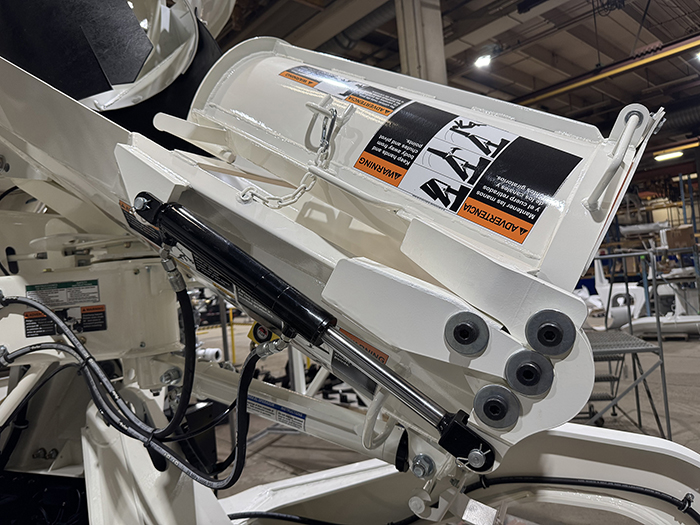 A close up of INTEGRALdx's hydraulic foldover chute, compatible with its line of concrete redi-mix trucks.