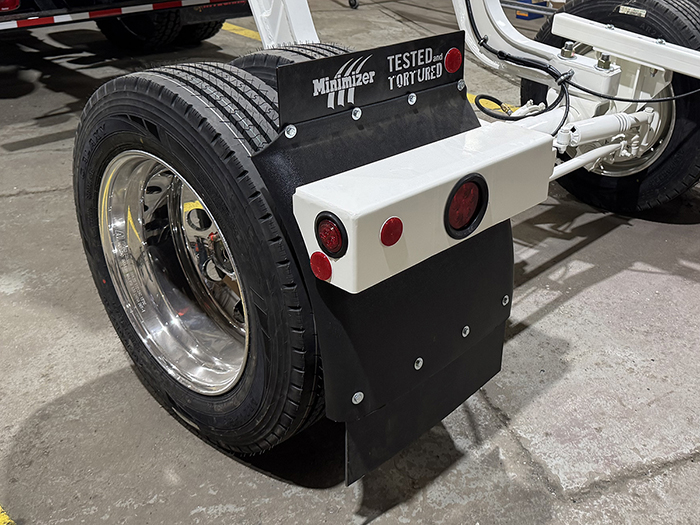 Mud flaps on the booster axle wheels of an INTEGRALdx concrete redi-mix truck.