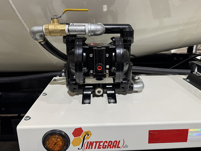 A pneumatic water pump, situated on the side of an INTEGRALdx concrete redi-mix truck
