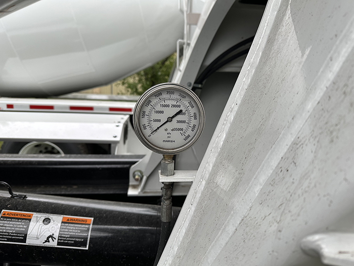 INTEGRALdx offers two positions for slump gauge placement on their concrete redi-mix trucks: near the gearbox or below the rear roller guard as pictured in this photo.