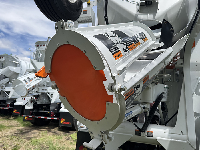 A view of an INTEGRALdx concrete redi-mix truck's street guard, which covers the chute when not in use to prevent accidental discharge from reaching the street.
