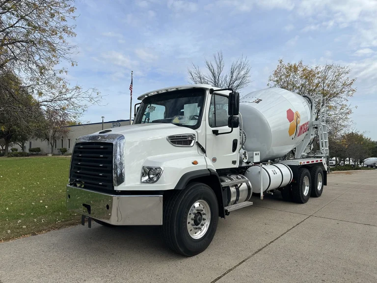 The front left view of an EASI REDI-Mix Truck.