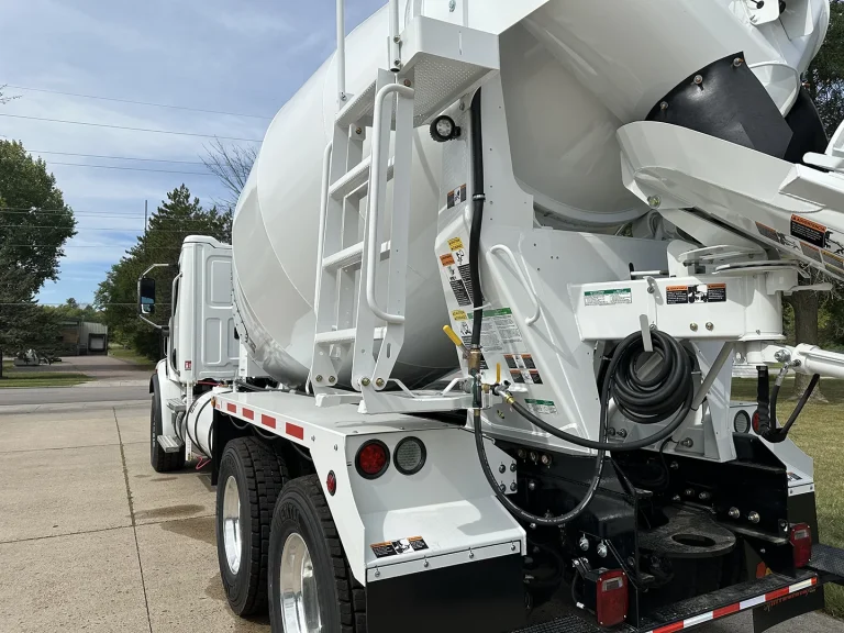 The rear left side of an EASI REDI-Mix Truck.