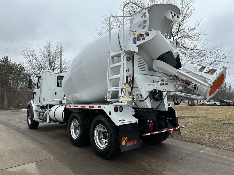 The rear left side of an EASI REDI-Mix Truck.