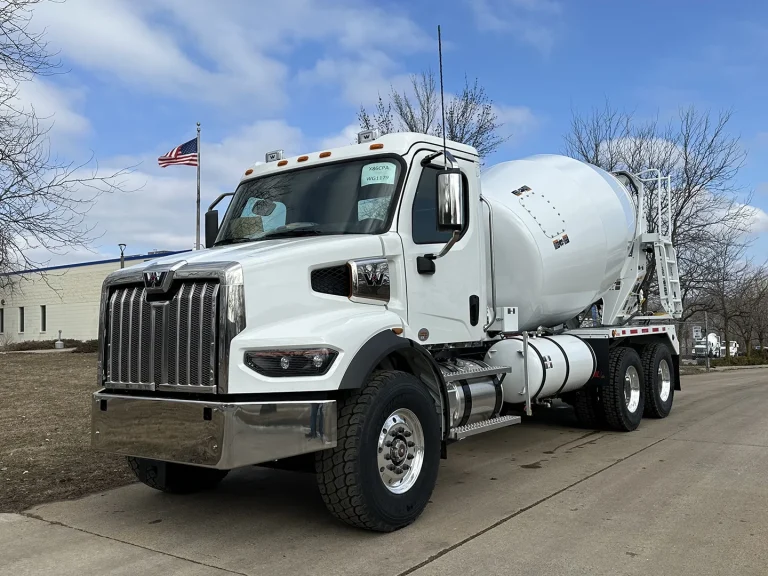The front left view of an EASI REDI-Mix Truck.
